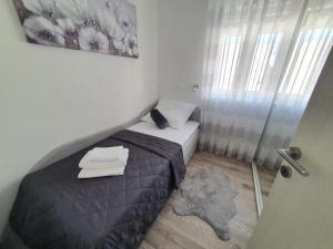 Katil atau katil-katil dalam bilik di Apartman Sunce