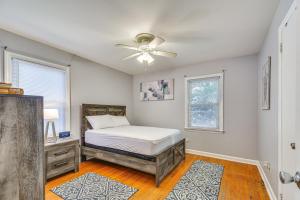 a bedroom with a bed and a ceiling fan at Raleigh Retreat about 5 Mi to Dtwn and Historic Oakwood! in Raleigh
