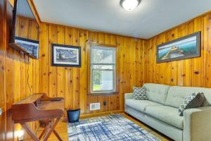 a living room with a couch and a piano at Raleigh Retreat about 5 Mi to Dtwn and Historic Oakwood! in Raleigh