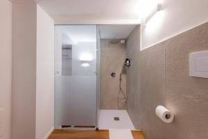 a shower with a glass door in a bathroom at BnButler - InBrera Suites - Giulianova, 1 in Milan