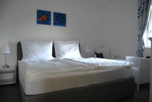 Postel nebo postele na pokoji v ubytování Ferienwohnung mit Pool in Wörthersee Nähe