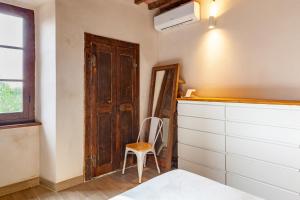 Ένα ή περισσότερα κρεβάτια σε δωμάτιο στο Loft vicino a Forte dei Marmi