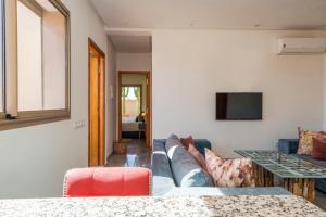 a living room with a couch and a table at dar al walidine in Marrakesh