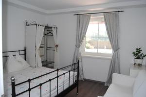Postel nebo postele na pokoji v ubytování Ferienwohnung mit Pool in Wörthersee Nähe