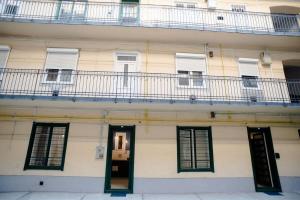 a white building with windows and a balcony at Cute, new and stylish apartment in the center in Budapest