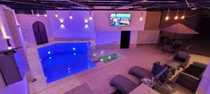 an overhead view of a swimming pool with a tv at Immeuble Thala Duplex in Tigzirt