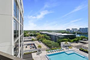 an aerial view of a building with a pool at Stylish Urban Retreat Steps from Lake Eola in Orlando