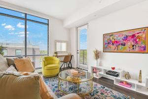 a living room with a couch and a table at Trendy Gateway by Lake Eola Free Parking in Orlando