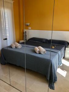 a bedroom with a bed with a glass wall at BRISA DEL MAR - 200m to the beach in Oliva