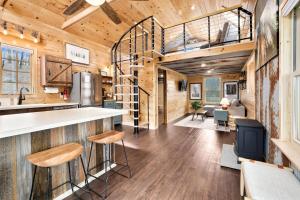 a kitchen and living room in a tiny house at Redwoods Rising - Sweeping Views-Hot Tub in West Fork +35 photos