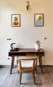 a wooden desk with a chair in a room at The Frostwood Resort in Rānīkhet