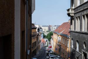 a view of a city street with buildings and cars at Comfy New apartment at Castle in Budapest