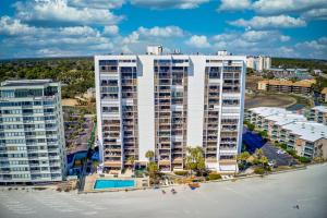 an aerial view of a large white apartment building at Oceanfront Custom and what a view of the ocean in Myrtle Beach