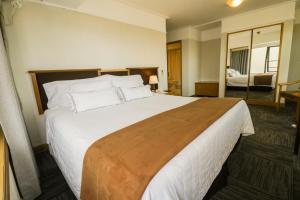 Postel nebo postele na pokoji v ubytování Hotel Miramar