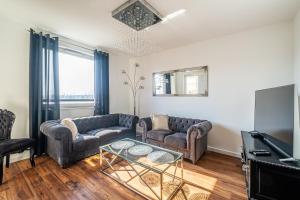 Televízia a/alebo spoločenská miestnosť v ubytovaní Apartament Kaskada Parking & Balcony by Axel