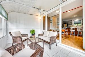 a living room with wicker chairs and a table at Mill Valley Home 5 Mi to Golden Gate Bridge! in Mill Valley