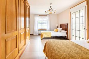 Posteľ alebo postele v izbe v ubytovaní GALIHOST - Casa con enorme jardín en Cambados