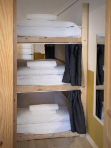 a closet with two bunk beds in a room at Apartamento con terraza in San Vicente de la Barquera