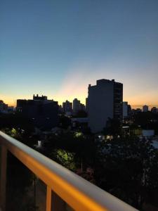 a view of a city skyline from a balcony at Fortunati Departamentos in General Sarmiento