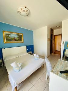 Postel nebo postele na pokoji v ubytování Albergo California + 19 fotografií