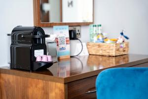 a counter with a coffee maker on top of it at The Western Hotel in Galway