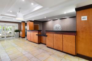 a lobby with a reception desk in a building at Fairfield Inn & Suites Fort Pierce / Port St Lucie in Fort Pierce