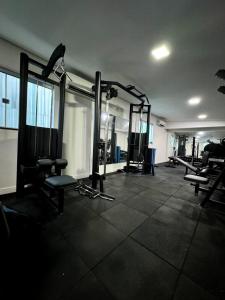 a gym with treadmills and machines in a room at Domus Hotel Cidade Nobre Ipatinga in Ipatinga