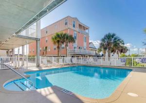 a large swimming pool in front of a building at Stunning and Spacious 5 BR Condo- With Ocean Views and more! Cherry Grove Villas 402 in Myrtle Beach