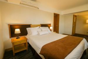 Postel nebo postele na pokoji v ubytování Hotel Miramar