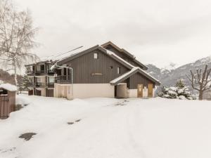 a house covered in snow with a yard at Appartement La Plagne Montalbert , 2 pièces, 5 personnes - FR-1-181-2723 in Aime-La Plagne