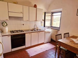 Virtuve vai virtuves zona naktsmītnē Casa del Viandante Romea del Chianti - Badia a Passignano