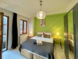 a bedroom with a bed with two slippers on it at Apartment w/ New Furnitures Next to Istiklal Street and Taksim Square in Istanbul