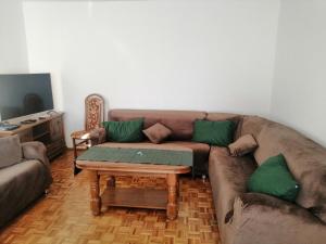 a living room with a couch and a coffee table at Willa Malbork in Wrocław