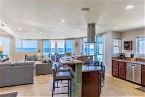 a kitchen and living room with a view of the ocean at B5026 Rockaway Oceanfront 2 in San Diego