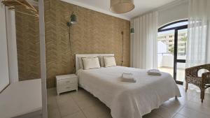 Ένα ή περισσότερα κρεβάτια σε δωμάτιο στο Casa Catarina +29 φωτογραφίες