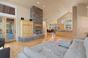 a living room with a couch and a fireplace at Lucy Lou 30 Day Minimum home in Bend
