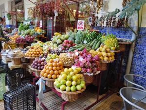 a display of fruits and vegetables in a market at Alexia Room in Funchal