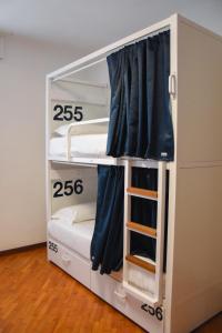 a bunk bed with two beds in a room at Bovisa Urban Garden in Milan