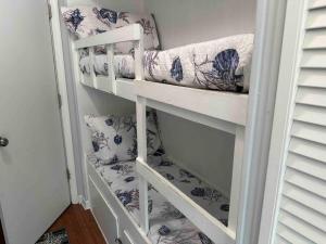 a staircase in a room with blue and white towels at Beachy Keen Seaside Villa Near Coligny with Bikes! in Hilton Head Island +22 photos