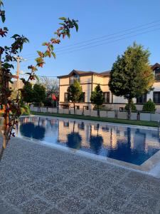 a pool of water in front of a building at akcayzeytin otel in Akcay