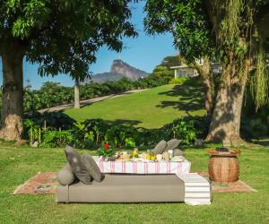 a table with food on it in the grass at Vila Santa Teresa in Rio de Janeiro