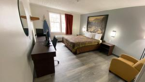 Postel nebo postele na pokoji v ubytování Syracuse Inn