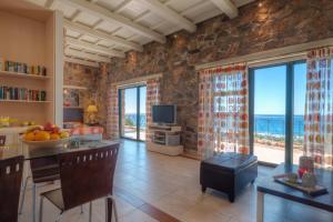 a living room with a view of the ocean at Seaview villa Amphitriti with Private Pool, 20 min from Elafonissi beach in Chania Town