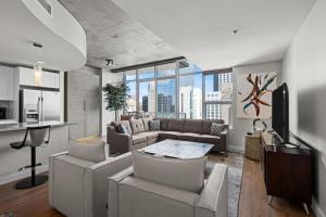 a living room with a couch and a table at Spire - Unit 1810 in Denver