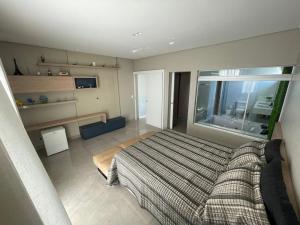 a bedroom with a large bed and a window at Casa em Santo Hilário - MG in Guapé +111 photos