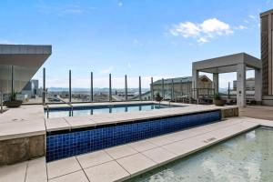 a swimming pool on the roof of a building at Spire - Unit 1810 in Denver