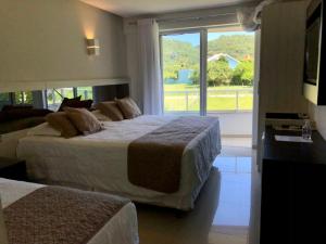 Postel nebo postele na pokoji v ubytování Reserva Praia Hotel