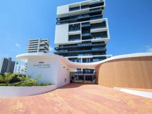 a building in front of a tall building at Calpesunrisetower in Calpe