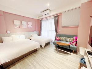 Giường trong phòng chung tại Ｎ 24.8 二館-宜蘭頭城民宿