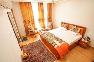 Ένα ή περισσότερα κρεβάτια σε δωμάτιο στο Zaabeel Villa Kashmir